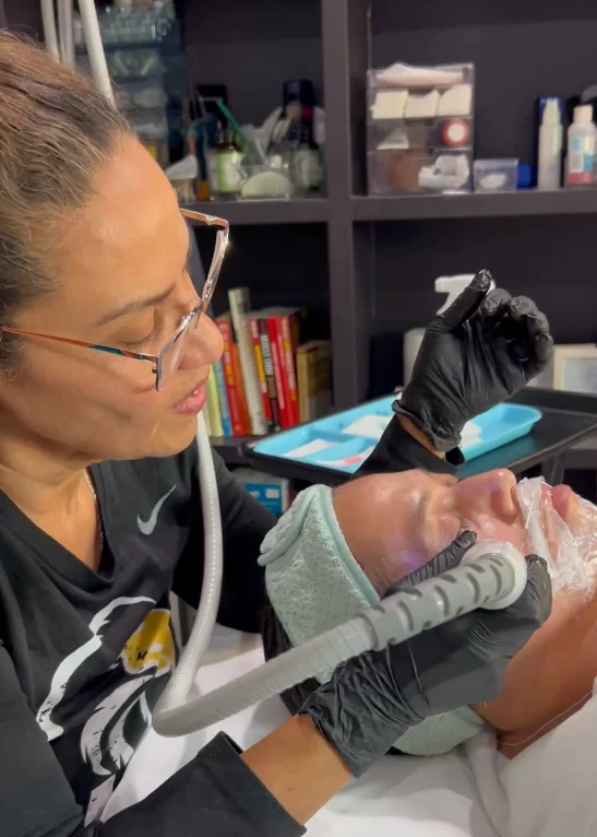 A person receiving a facial treatment at a medspa
